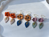 Shimmery burnt orange flower dangles